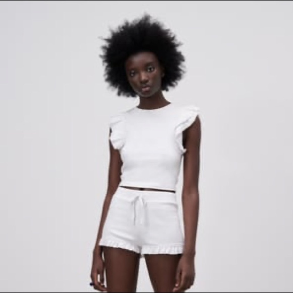 White ruffled sleeve top